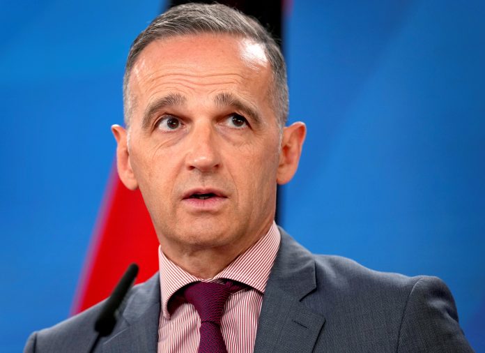 Abdullatif bin Rashid Al-Zayani and Heiko Maas attend a news conference in Berlin
